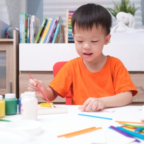 asian-toddler-boy-enjoy-using-glue-doing-arts-home.jpg
